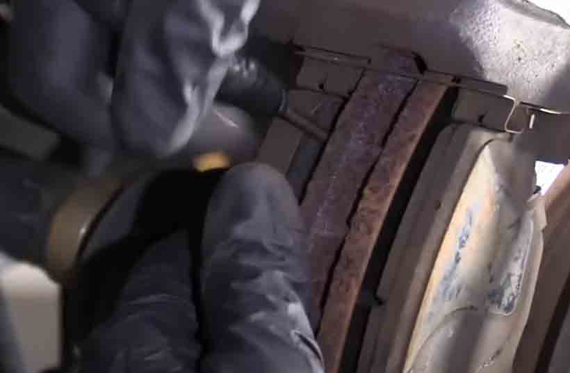 Mobile Brake Service in Orem. Removing old brake pads.